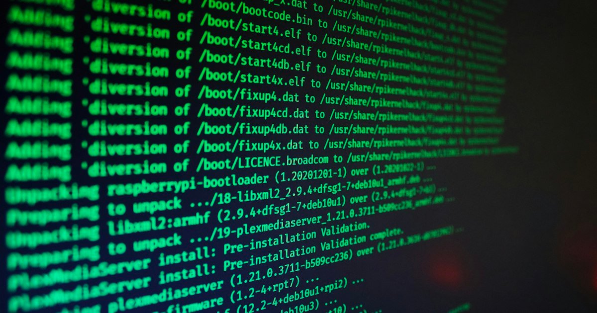 Green code scrolling on a dark computer screen