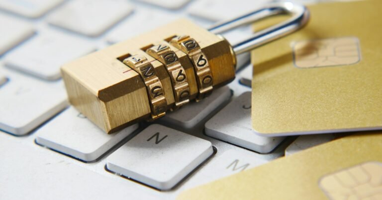 Padlock resting on a laptop keyboard, representing online privacy and security